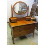 An inlaid Edwardian mahogany dressing chest with satinwood banding and oval bevelled edge mirror