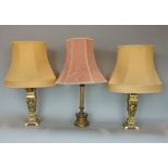 Pair of cast brass square baluster table lamps, pierced with cherubs, with shades, together with a