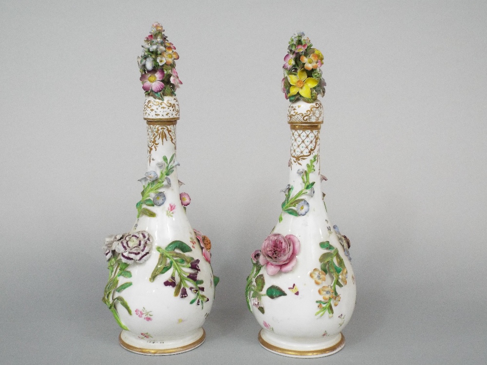 A pair of 19th century white ground bottles and stoppers of slender form with painted and - Image 2 of 5