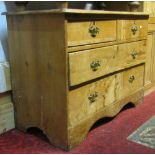 A low late Victorian/Edwardian stripped pine bedroom chest of two short over two long graduated