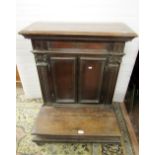 A 19th century continental walnut kneeler, with slightly sloping top over a frieze drawer and two