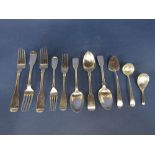 Three antique Irish silver fiddle pattern table forks, with sauce ladle, small cake slice and