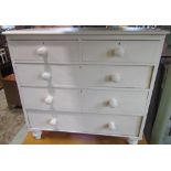 A Victorian pine bedroom chest of two short over three long drawers, raised on turned supports, with