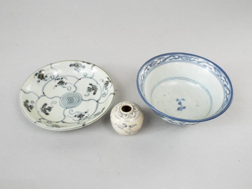 A collection of three pieces of oriental ceramic recovered from shipwrecks and including small