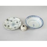 A collection of three pieces of oriental ceramic recovered from shipwrecks and including small