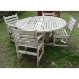 A Royal Arrow contemporary weathered plantation teak garden table of circular form with slatted
