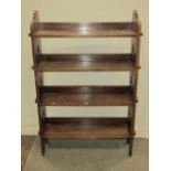 An oak freestanding open bookcase with four pegged shelves and pierced Gothic trefoil detail, approx