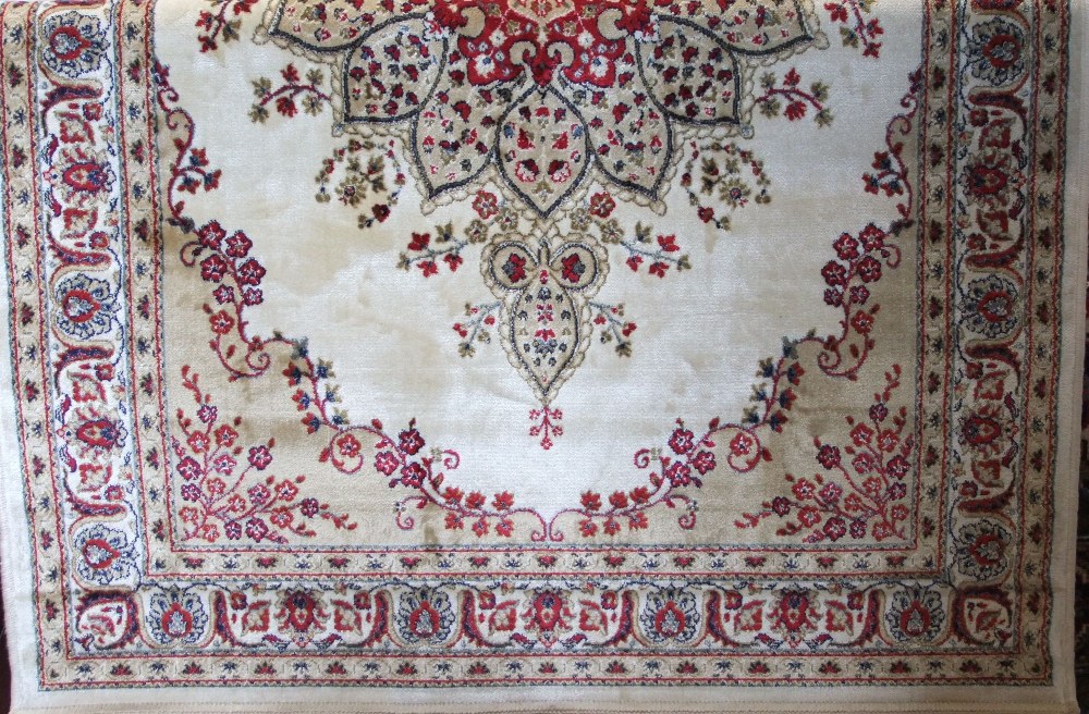 Kashmir rug, floral medallion design, ivory and gold ground, 175 x 120cm