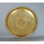 Arts and crafts brass charger by John W Singer with central engraved monogram, framed by further