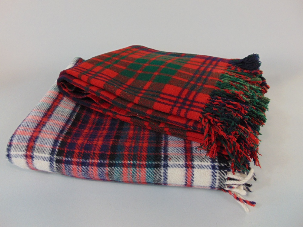 Two Tartan woollen travel blankets together with four hand crochet blankets and a tartan style scarf