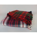 Two Tartan woollen travel blankets together with four hand crochet blankets and a tartan style scarf