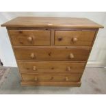 A contemporary solid pine bedroom chest of two short over three long drawers set on a moulded