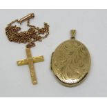 9ct oval locket with engraved scrolled decoration, together with a further 9ct scrolled cross
