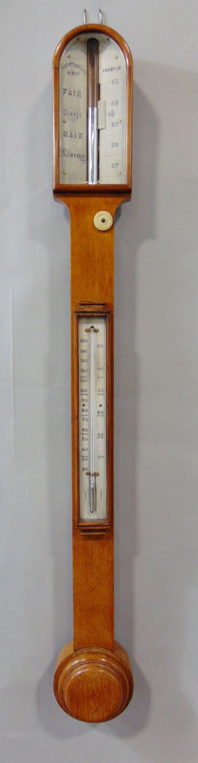 A good 19th century golden oak stick mercury barometer/thermometer, by G Cartwright & Son or