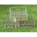 A stack of nine vintage galvanised steel milk crates, each to hold sixteen bottles