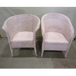 Two similar Lloyd Loom chairs with shaped outline, both with later light pink painted finish