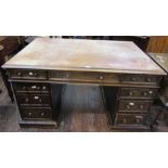 A Victorian pedestal writing desk, one side fitted with an arrangement of nine drawers, the other