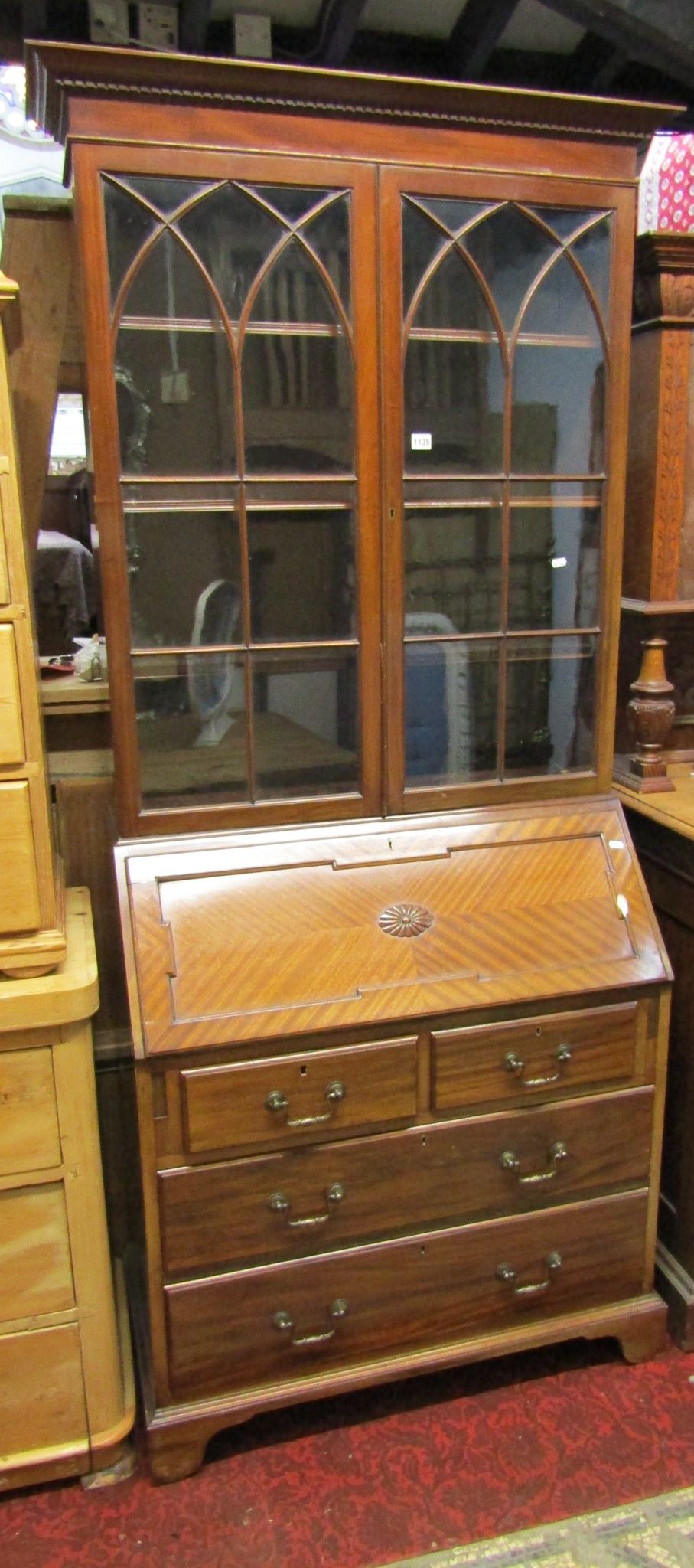 A good quality Edwardian mahogany bureau bookcase in the Georgian style, the upper section