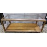 A retro teak two tier coffee table of rectangular form with inset glass top, 112cm long x 54cm