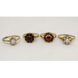 Four 9ct dress rings to include two garnet flower head examples, 7.2g total (4)