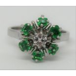 Vintage 18ct white gold emerald and diamond flower head ring with French eagle stamp to shank,