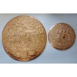 Embossed Indian copper circular plaque decorated with a procession of figures in a mountainous