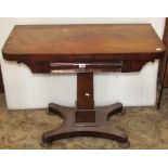 A Victorian mahogany fold over top card table with moulded frieze over and raised on a central