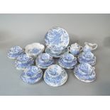 A collection of Royal Worcester blue dragon pattern teawares comprising seven cups, seven saucers