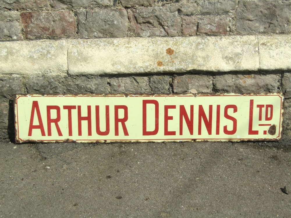 A vintage enamel sign of rectangular form - Arthur Dennis Ltd, with red lettering on a cream