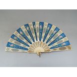 19th century French bone and silk brisé fan, the bone with carved fretwork panels, the silk