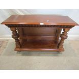 A 19th century walnut open shelving unit, with rectangular panelled back, turned columns and moulded