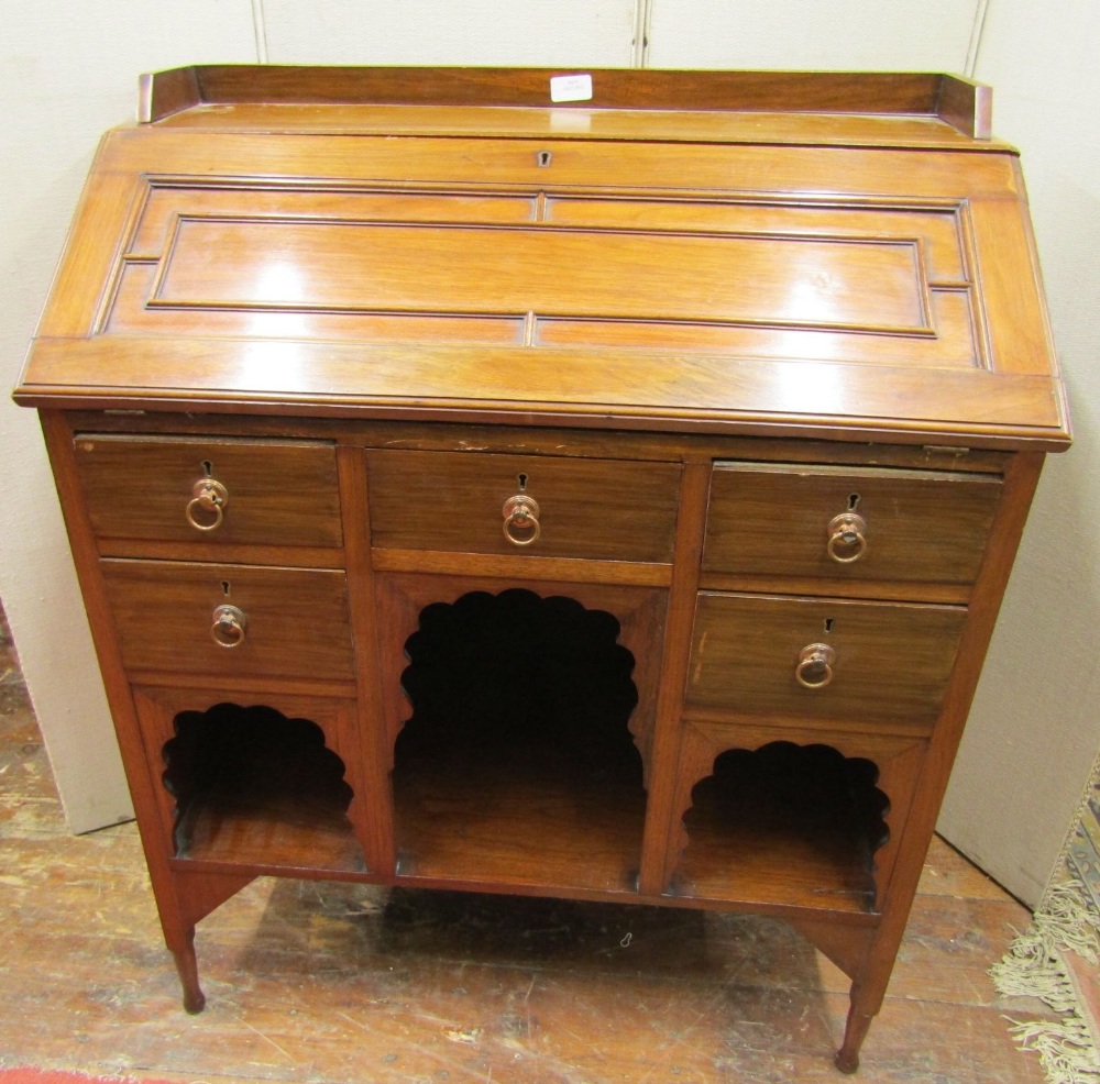 A late 19th century walnut ladies writing desk, the fall flap with panelled detail over a kneehole