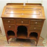 A late 19th century walnut ladies writing desk, the fall flap with panelled detail over a kneehole