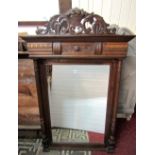 A late 19th century wall mirror with rectangular bevelled edge mirror plate within an oak frame,