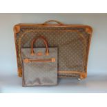 Louis Vuitton leather trimmed soft sided suitcase circa 1970s, with zipped opening, initialled