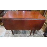 A 19th century mahogany side table with a deep well disguised frieze drawer, raised on partially