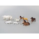 A collection of Beswick foals including white examples with dappled grey patches, Shetland foal,
