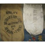 A plywood linen barrel together with a US mail bag and a sack with printed lettering (3)