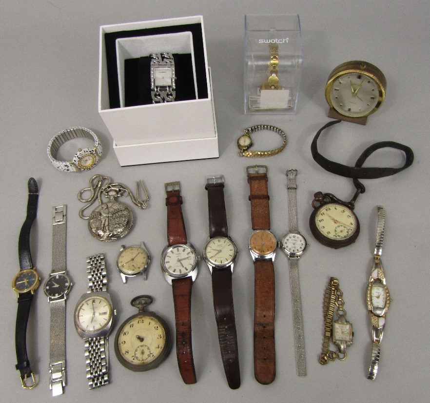 A box containing a collection of various vintage watches and time pieces to include Tissot Seastar