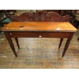 A good quality Regency mahogany hall table of rectangular form, with raised back and shell