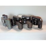 Four pairs of mixed binoculars to include two pairs of 7x50, with 10x50 and 8x40 by Chinon,