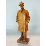 Black Forest carving of a standing gentleman in an overcoat inscribed G. Puccini, signed G
