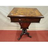 A Victorian walnut and straw work marquetry ladies sewing/games table. the foldover top with chequer