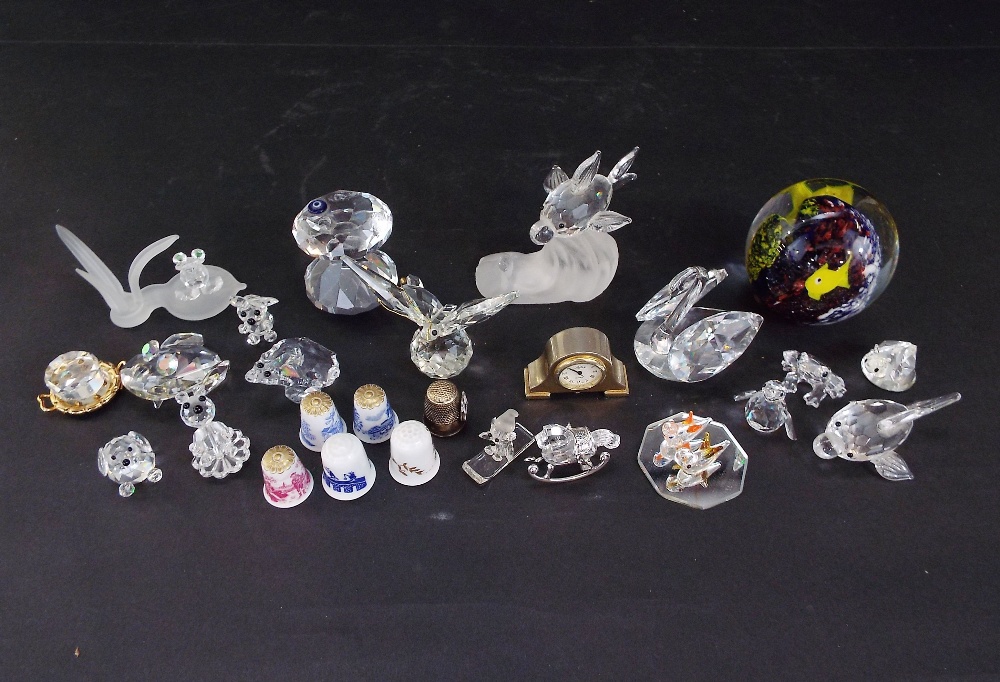 A collection of mainly Swarovski crystal animals together with a small quantity of thimbles, a