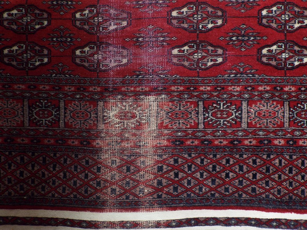 Bokhara runner with typical geometric medallion decoration upon a red ground, 480 x 130 cm - Image 2 of 2