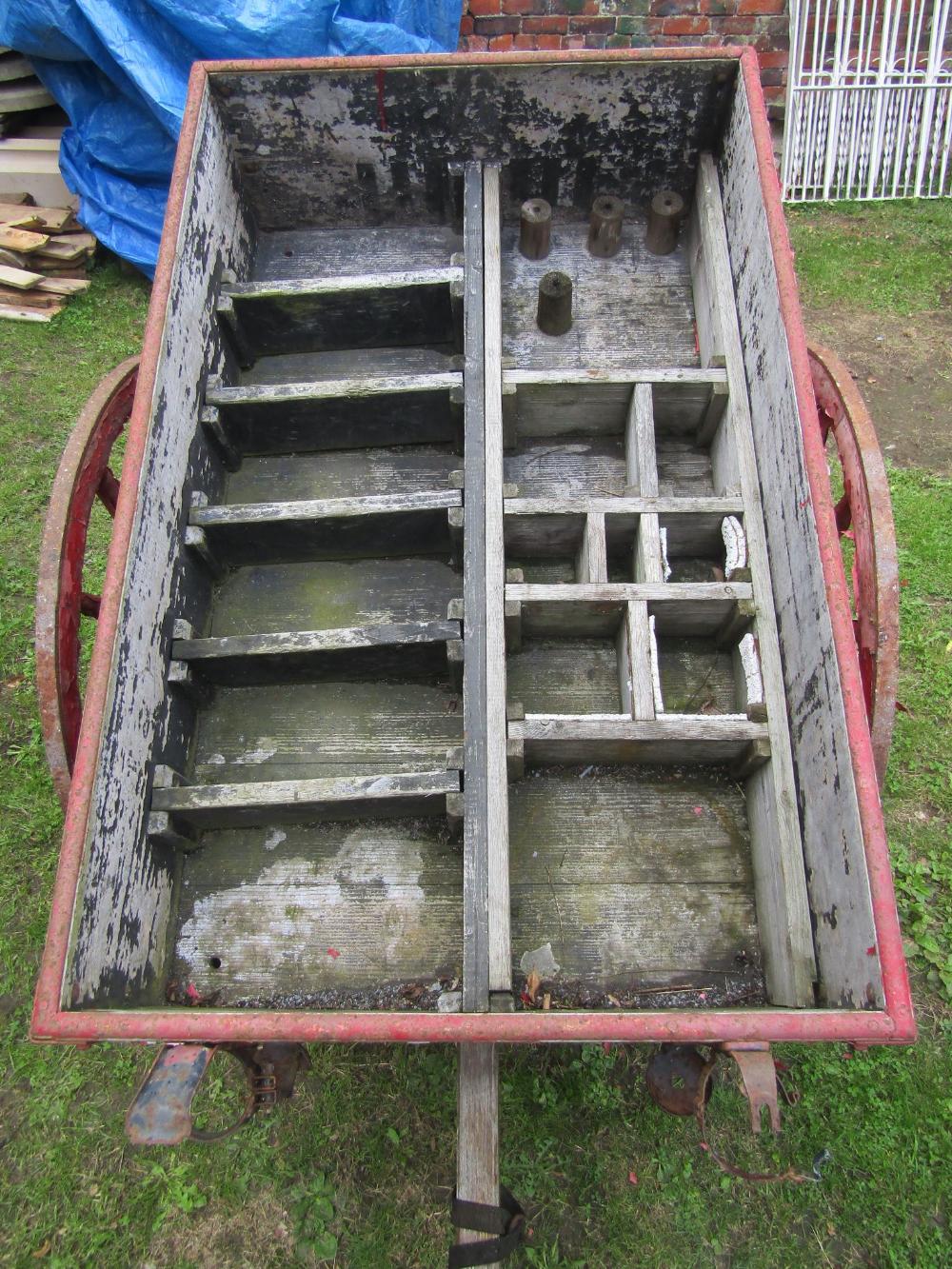 A vintage wooden hand cart with iron fittings, two spoke wheels with iron rims and red painted - Image 2 of 4