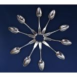 Set of ten Georgian silver fiddle pattern teaspoons, makers marks worn, possibly London 1809, 6oz