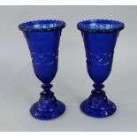 A pair of late 19th century navy blue pressed glass goblets with interesting studded banded