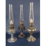 Three similar Aladdin chrome oil lamps, each 28 cm high approx with chimneys (3)