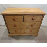 A late Victorian stripped pine bedroom chest of two short over two long graduated drawers with